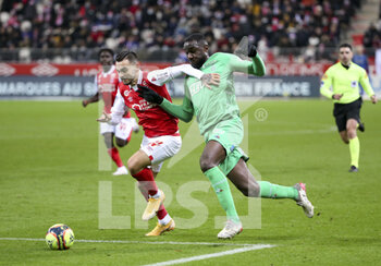 2021-12-11 - Anastasios Donis of Reims, Mickael Nade of Saint-Etienne during the French championship Ligue 1 football match between Stade de Reims and AS Saint-Etienne (ASSE) on December 11, 2021 at Stade Auguste Delaune in Reims, France - STADE DE REIMS VS AS SAINT-ETIENNE (ASSE) - FRENCH LIGUE 1 - SOCCER