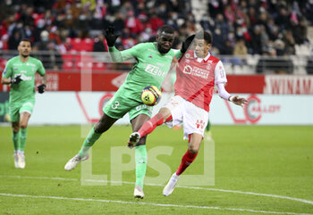 2021-12-11 - Mickael Nade of Saint-Etienne, Hugo Ekitike of Reims during the French championship Ligue 1 football match between Stade de Reims and AS Saint-Etienne (ASSE) on December 11, 2021 at Stade Auguste Delaune in Reims, France - STADE DE REIMS VS AS SAINT-ETIENNE (ASSE) - FRENCH LIGUE 1 - SOCCER