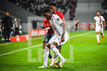 2021-12-12 - Castello LUKEBA of Lyon and Jonathan DAVID of Lille during the French championship Ligue 1 football match between LOSC Lille and Olympique Lyonnais (Lyon) on December 12, 2021 at Pierre Mauroy stadium in Villeneuve-d'Ascq near Lille, France - LOSC LILLE VS OLYMPIQUE LYONNAIS (LYON) - FRENCH LIGUE 1 - SOCCER