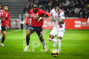 2021-12-12 - Jonathan IKONE of Lille and Castello LUKEBA of Lyon during the French championship Ligue 1 football match between LOSC Lille and Olympique Lyonnais (Lyon) on December 12, 2021 at Pierre Mauroy stadium in Villeneuve-d'Ascq near Lille, France - LOSC LILLE VS OLYMPIQUE LYONNAIS (LYON) - FRENCH LIGUE 1 - SOCCER