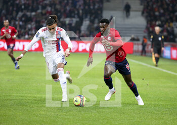 2021-12-12 - Jonathan Bamba of Lille, Malo Gusto of Lyon (left) during the French championship Ligue 1 football match between Lille OSC (LOSC) and Olympique Lyonnais (Lyon, OL) on December 12, 2021 at Stade Pierre Mauroy in Villeneuve-d'Ascq near Lille, France - LOSC LILLE VS OLYMPIQUE LYONNAIS (LYON) - FRENCH LIGUE 1 - SOCCER