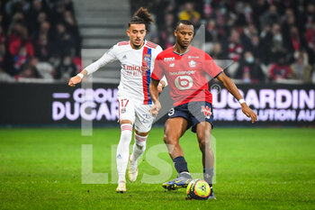2021-12-12 - Malo GUSTO of Lyon and Tiago DJALO of Lille during the French championship Ligue 1 football match between LOSC Lille and Olympique Lyonnais (Lyon) on December 12, 2021 at Pierre Mauroy stadium in Villeneuve-d'Ascq near Lille, France - LOSC LILLE VS OLYMPIQUE LYONNAIS (LYON) - FRENCH LIGUE 1 - SOCCER