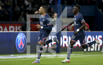 2021-12-12 - Kylian Mbappe of PSG celebrates his goal with Idrissa Gueye Gana during the French championship Ligue 1 football match between Paris Saint-Germain (PSG) and AS Monaco (ASM) on December 12, 2021 at Parc des Princes stadium in Paris, France - PARIS SAINT-GERMAIN VS AS MONACO - FRENCH LIGUE 1 - SOCCER