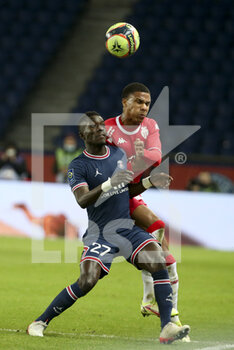 2021-12-12 - Idrissa Gueye Gana of PSG, Ismail Jakobs of Monaco during the French championship Ligue 1 football match between Paris Saint-Germain (PSG) and AS Monaco (ASM) on December 12, 2021 at Parc des Princes stadium in Paris, France - PARIS SAINT-GERMAIN VS AS MONACO - FRENCH LIGUE 1 - SOCCER