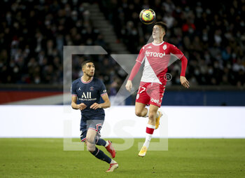 2021-12-12 - Aleksandr Golovin of Monaco, Achraf Hakimi of PSG (left) during the French championship Ligue 1 football match between Paris Saint-Germain (PSG) and AS Monaco (ASM) on December 12, 2021 at Parc des Princes stadium in Paris, France - PARIS SAINT-GERMAIN VS AS MONACO - FRENCH LIGUE 1 - SOCCER
