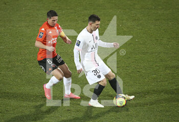 2021-12-22 - Lionel Messi of PSG, Laurent Abergel of Lorient (left) during the French championship Ligue 1 football match between Fc Lorient (FCL) and Paris Saint-Germain (PSG) on December 22, 2021 at Stade du Moustoir in Lorient, France - FC LORIENT (FCL) VS PARIS SAINT-GERMAIN (PSG) - FRENCH LIGUE 1 - SOCCER