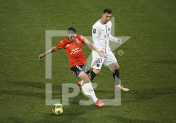2021-12-22 - Laurent Abergel of Lorient, Lionel Messi of PSG during the French championship Ligue 1 football match between Fc Lorient (FCL) and Paris Saint-Germain (PSG) on December 22, 2021 at Stade du Moustoir in Lorient, France - FC LORIENT (FCL) VS PARIS SAINT-GERMAIN (PSG) - FRENCH LIGUE 1 - SOCCER
