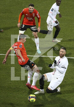 2021-12-22 - Sergio Ramos of PSG, Laurent Abergel of Lorient (left) during the French championship Ligue 1 football match between Fc Lorient (FCL) and Paris Saint-Germain (PSG) on December 22, 2021 at Stade du Moustoir in Lorient, France - FC LORIENT (FCL) VS PARIS SAINT-GERMAIN (PSG) - FRENCH LIGUE 1 - SOCCER