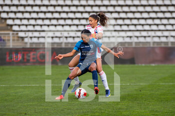 2021-12-12 - Delphine Cascarino of Olympique Lyonnais and Eseosa Aigbogun of Paris FC fight for the ball during the Women's French championship D1 Arkema football match between Paris FC and Olympique Lyonnais on December 12, 2021 at Charlety stadium in Paris, France - PARIS FC VS OLYMPIQUE LYONNAIS - FRENCH WOMEN DIVISION 1 - SOCCER