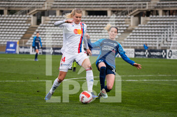 2021-12-12 - Ada Hegerberg of Olympique Lyonnais and Anaig Butel of Paris FC fight for the ball during the Women's French championship D1 Arkema football match between Paris FC and Olympique Lyonnais on December 12, 2021 at Charlety stadium in Paris, France - PARIS FC VS OLYMPIQUE LYONNAIS - FRENCH WOMEN DIVISION 1 - SOCCER