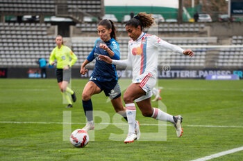 2021-12-12 - Clara Mateo of Paris FC and Catarina Macario of Olympique Lyonnais fight for the ball during the Women's French championship D1 Arkema football match between Paris FC and Olympique Lyonnais on December 12, 2021 at Charlety stadium in Paris, France - PARIS FC VS OLYMPIQUE LYONNAIS - FRENCH WOMEN DIVISION 1 - SOCCER