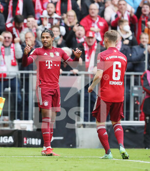 2021-10-23 - Serge Gnabry of Bayern Munich celebrates after his goal 1-0 with Joshua Kimmich during the German championship Bundesliga football match between Bayern Munich and TSG 1899 Hoffenheim on October 23, 2021 at Allianz Arena in Munich, Germany - BAYERN MUNICH VS TSG 1899 HOFFENHEIM - GERMAN BUNDESLIGA - SOCCER
