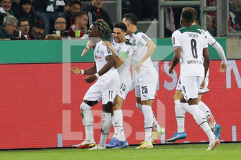 2021-10-27 - Kouadio Kone of Monchengladbach celebrates after his goal 1-0 with teammates during the German Cup, 2nd round football match between Borussia Monchengladbach and Bayern Munich on October 27, 2021 at Borussia-Park in Monchengladbach, Germany - BORUSSIA MONCHENGLADBACH VS BAYERN MUNICH - GERMAN BUNDESLIGA - SOCCER