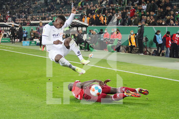 2021-10-27 - Breel Embolo of Monchengladbach is tackled by Dayot Upamecano of Bayern Munich during the German Cup, 2nd round football match between Borussia Monchengladbach and Bayern Munich on October 27, 2021 at Borussia-Park in Monchengladbach, Germany - BORUSSIA MONCHENGLADBACH VS BAYERN MUNICH - GERMAN BUNDESLIGA - SOCCER