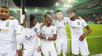 2021-10-27 - Kouadio Kone, Ramy Bensebaini and Breel Embolo of Monchengladbach celebrate after the German Cup, 2nd round football match between Borussia Monchengladbach and Bayern Munich on October 27, 2021 at Borussia-Park in Monchengladbach, Germany - BORUSSIA MONCHENGLADBACH VS BAYERN MUNICH - GERMAN BUNDESLIGA - SOCCER