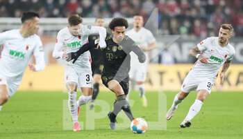 2021-11-19 - Leroy Sane of Bayern Munich and Mads Pedersen of Augsburg during the German championship Bundesliga football match between FC Augsburg and Bayern Munich on November 19, 2021 at WWK Arena in Augsburg, Germany - FC AUGSBURG VS BAYERN MUNICH - GERMAN BUNDESLIGA - SOCCER