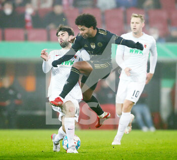 2021-11-19 - Serge Gnabry of Bayern Munich and Jan Moravek of Augsburg during the German championship Bundesliga football match between FC Augsburg and Bayern Munich on November 19, 2021 at WWK Arena in Augsburg, Germany - FC AUGSBURG VS BAYERN MUNICH - GERMAN BUNDESLIGA - SOCCER