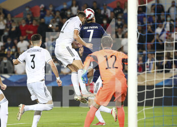 2021-09-01 - Antoine Griezmann of France scores his goal despite Edin Dzeko of Bosnia and Herzegovina during the FIFA World Cup Qatar 2022, Qualifiers, Group D football match between France and Bosnia and Herzegovina on September 1, 2021 at Stade de La Meinau in Strasbourg, France - FIFA WORLD CUP QATAR 2022, QUALIFIERS, GROUP D - FRANCE AND BOSNIA AND HERZEGOVINA - FIFA WORLD CUP - SOCCER