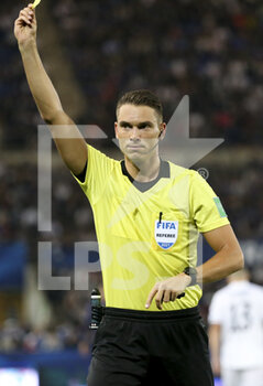 2021-09-01 - Referee Sandro Schaerer of Switzerland gives a yellow card during the FIFA World Cup Qatar 2022, Qualifiers, Group D football match between France and Bosnia and Herzegovina on September 1, 2021 at Stade de La Meinau in Strasbourg, France - FIFA WORLD CUP QATAR 2022, QUALIFIERS, GROUP D - FRANCE AND BOSNIA AND HERZEGOVINA - FIFA WORLD CUP - SOCCER