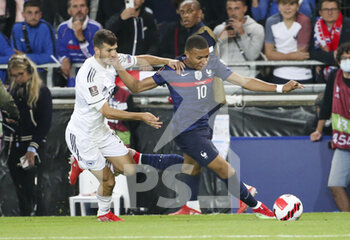 2021-09-01 - Kylian Mbappe of France, Branimir Cipetik of Bosnia and Herzegovina (left) during the FIFA World Cup Qatar 2022, Qualifiers, Group D football match between France and Bosnia and Herzegovina on September 1, 2021 at Stade de La Meinau in Strasbourg, France - FIFA WORLD CUP QATAR 2022, QUALIFIERS, GROUP D - FRANCE AND BOSNIA AND HERZEGOVINA - FIFA WORLD CUP - SOCCER