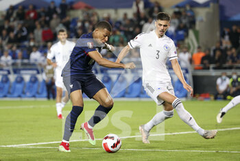 2021-09-01 - Kylian Mbappe of France, Dennis Hadzikadunic of Bosnia and Herzegovina during the FIFA World Cup Qatar 2022, Qualifiers, Group D football match between France and Bosnia and Herzegovina on September 1, 2021 at Stade de La Meinau in Strasbourg, France - FIFA WORLD CUP QATAR 2022, QUALIFIERS, GROUP D - FRANCE AND BOSNIA AND HERZEGOVINA - FIFA WORLD CUP - SOCCER