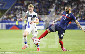 2021-09-07 - Rasmus Schuller of Finland, Karim Benzema of France during the FIFA World Cup Qatar 2022, Qualifiers, Group D football match between France and Finland on September 7, 2021 at Groupama stadium in Decines-Charpieu near Lyon, France - FIFA WORLD CUP QATAR 2022, QUALIFIERS, GROUP D - FRANCE AND FINLAND - FIFA WORLD CUP - SOCCER