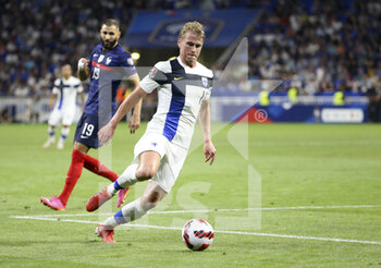 2021-09-07 - Rasmus Schuller of Finland, Karim Benzema of France (left) during the FIFA World Cup Qatar 2022, Qualifiers, Group D football match between France and Finland on September 7, 2021 at Groupama stadium in Decines-Charpieu near Lyon, France - FIFA WORLD CUP QATAR 2022, QUALIFIERS, GROUP D - FRANCE AND FINLAND - FIFA WORLD CUP - SOCCER