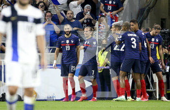 2021-09-07 - Antoine Griezmann celebrates his first goal with Karim Benzema (left) during the FIFA World Cup Qatar 2022, Qualifiers, Group D football match between France and Finland on September 7, 2021 at Groupama stadium in Decines-Charpieu near Lyon, France - FIFA WORLD CUP QATAR 2022, QUALIFIERS, GROUP D - FRANCE AND FINLAND - FIFA WORLD CUP - SOCCER