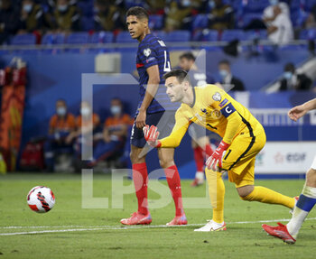 2021-09-07 - Goalkeeper of France Hugo Lloris, Raphael Varane of France (left) during the FIFA World Cup Qatar 2022, Qualifiers, Group D football match between France and Finland on September 7, 2021 at Groupama stadium in Decines-Charpieu near Lyon, France - FIFA WORLD CUP QATAR 2022, QUALIFIERS, GROUP D - FRANCE AND FINLAND - FIFA WORLD CUP - SOCCER