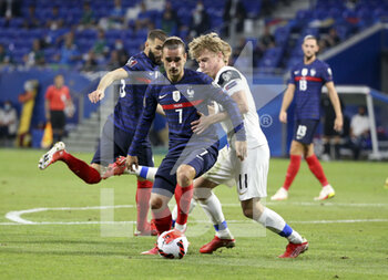 2021-09-07 - Antoine Griezmann of France, Rasmus Schuller of Finland during the FIFA World Cup Qatar 2022, Qualifiers, Group D football match between France and Finland on September 7, 2021 at Groupama stadium in Decines-Charpieu near Lyon, France - FIFA WORLD CUP QATAR 2022, QUALIFIERS, GROUP D - FRANCE AND FINLAND - FIFA WORLD CUP - SOCCER