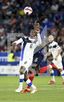 2021-09-07 - Glen Kamara of Finland, Paul Pogba of France during the FIFA World Cup Qatar 2022, Qualifiers, Group D football match between France and Finland on September 7, 2021 at Groupama stadium in Decines-Charpieu near Lyon, France - FIFA WORLD CUP QATAR 2022, QUALIFIERS, GROUP D - FRANCE AND FINLAND - FIFA WORLD CUP - SOCCER