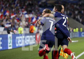 2021-09-07 - Antoine Griezmann of France celebrates his second goal with Leo Dubois during the FIFA World Cup Qatar 2022, Qualifiers, Group D football match between France and Finland on September 7, 2021 at Groupama stadium in Decines-Charpieu near Lyon, France - FIFA WORLD CUP QATAR 2022, QUALIFIERS, GROUP D - FRANCE AND FINLAND - FIFA WORLD CUP - SOCCER