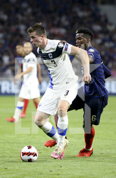 2021-09-07 - Daniel O?Shaughnessy of Finland, Paul Pogba of France during the FIFA World Cup Qatar 2022, Qualifiers, Group D football match between France and Finland on September 7, 2021 at Groupama stadium in Decines-Charpieu near Lyon, France - FIFA WORLD CUP QATAR 2022, QUALIFIERS, GROUP D - FRANCE AND FINLAND - FIFA WORLD CUP - SOCCER