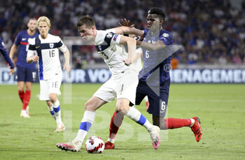 2021-09-07 - Daniel O?Shaughnessy of Finland, Paul Pogba of France during the FIFA World Cup Qatar 2022, Qualifiers, Group D football match between France and Finland on September 7, 2021 at Groupama stadium in Decines-Charpieu near Lyon, France - FIFA WORLD CUP QATAR 2022, QUALIFIERS, GROUP D - FRANCE AND FINLAND - FIFA WORLD CUP - SOCCER