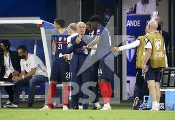 2021-09-07 - Coach of France Didier Deschamps talks to Aurelien Tchouameni of France during the FIFA World Cup Qatar 2022, Qualifiers, Group D football match between France and Finland on September 7, 2021 at Groupama stadium in Decines-Charpieu near Lyon, France - FIFA WORLD CUP QATAR 2022, QUALIFIERS, GROUP D - FRANCE AND FINLAND - FIFA WORLD CUP - SOCCER