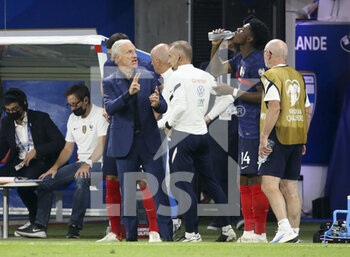 2021-09-07 - Coach of France Didier Deschamps talks to Aurelien Tchouameni of France during the FIFA World Cup Qatar 2022, Qualifiers, Group D football match between France and Finland on September 7, 2021 at Groupama stadium in Decines-Charpieu near Lyon, France - FIFA WORLD CUP QATAR 2022, QUALIFIERS, GROUP D - FRANCE AND FINLAND - FIFA WORLD CUP - SOCCER