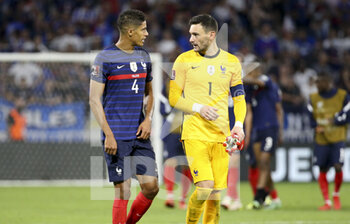 2021-09-07 - Raphael Varane, goalkeeper of France Hugo Lloris following the FIFA World Cup Qatar 2022, Qualifiers, Group D football match between France and Finland on September 7, 2021 at Groupama stadium in Decines-Charpieu near Lyon, France - FIFA WORLD CUP QATAR 2022, QUALIFIERS, GROUP D - FRANCE AND FINLAND - FIFA WORLD CUP - SOCCER