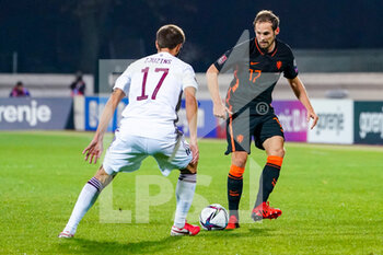 2021-10-08 - Arturs Zjuzins of Latvia, Daley Blind of the Netherlands during the FIFA World Cup 2022, Qualifiers football match between Latvia and Netherlands on October 8, 2021 at Daugava Stadium in Riga, Latvia - FIFA WORLD CUP 2022, QUALIFIERS - LATVIA AND NETHERLANDS - FIFA WORLD CUP - SOCCER