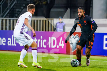 2021-10-08 - Elvis Stuglis of Latvia, Memphis Depay of the Netherlands during the FIFA World Cup 2022, Qualifiers football match between Latvia and Netherlands on October 8, 2021 at Daugava Stadium in Riga, Latvia - FIFA WORLD CUP 2022, QUALIFIERS - LATVIA AND NETHERLANDS - FIFA WORLD CUP - SOCCER