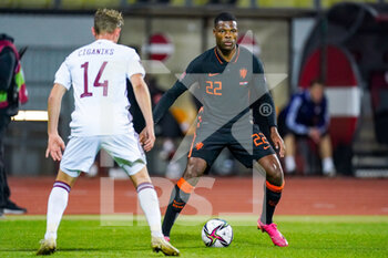 2021-10-08 - Andrejs Ciganiks of Latvia, Denzel Dumfries of the Netherlands during the FIFA World Cup 2022, Qualifiers football match between Latvia and Netherlands on October 8, 2021 at Daugava Stadium in Riga, Latvia - FIFA WORLD CUP 2022, QUALIFIERS - LATVIA AND NETHERLANDS - FIFA WORLD CUP - SOCCER