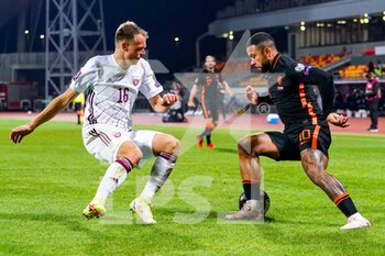 2021-10-08 - Alvis Jaunzems of Latvia, Memphis Depay of the Netherlands during the FIFA World Cup 2022, Qualifiers football match between Latvia and Netherlands on October 8, 2021 at Daugava Stadium in Riga, Latvia - FIFA WORLD CUP 2022, QUALIFIERS - LATVIA AND NETHERLANDS - FIFA WORLD CUP - SOCCER