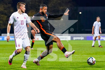 2021-10-08 - Roberts Savalnieks of Latvia, Memphis Depay of the Netherlands during the FIFA World Cup 2022, Qualifiers football match between Latvia and Netherlands on October 8, 2021 at Daugava Stadium in Riga, Latvia - FIFA WORLD CUP 2022, QUALIFIERS - LATVIA AND NETHERLANDS - FIFA WORLD CUP - SOCCER