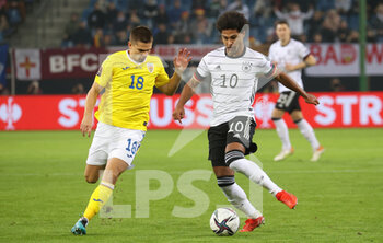 2021-10-08 - Serge Gnabry of Germany and Razvan Marin of Romania during the FIFA World Cup 2022, Qualifiers Group J football match between Germany and Romania on October 8, 2021 at Volksparkstadion in Hamburg, Germany - FIFA WORLD CUP 2022, QUALIFIERS GROUP J - GERMANY VS ROMANIA - FIFA WORLD CUP - SOCCER