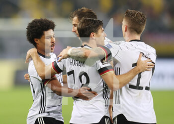 2021-10-08 - Serge Gnabry of Germany celebrates his goal with teammates during the FIFA World Cup 2022, Qualifiers Group J football match between Germany and Romania on October 8, 2021 at Volksparkstadion in Hamburg, Germany - FIFA WORLD CUP 2022, QUALIFIERS GROUP J - GERMANY VS ROMANIA - FIFA WORLD CUP - SOCCER