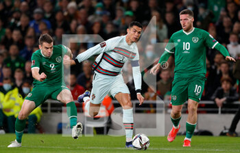 2021-11-11 - Cristiano Ronaldo of Portugal and Seamus Coleman of Ireland during the FIFA World Cup 2022, Qualifiers Group A football match between Republic of Ireland and Portugal on November 11, 2021 at Aviva Stadium in Dublin, Republic of Ireland - REPUBLIC OF IRELAND VS PORTUGAL - FIFA WORLD CUP - SOCCER