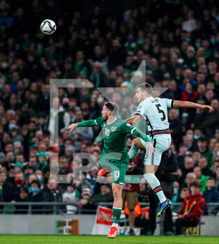 2021-11-11 - Matt Doherty of Ireland and Diogo Dalot of Portugal during the FIFA World Cup 2022, Qualifiers Group A football match between Republic of Ireland and Portugal on November 11, 2021 at Aviva Stadium in Dublin, Republic of Ireland - REPUBLIC OF IRELAND VS PORTUGAL - FIFA WORLD CUP - SOCCER