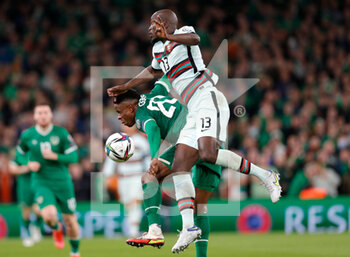 2021-11-11 - Danilo Pereira of Portugal and Chiedozie Ogbene of Ireland during the FIFA World Cup 2022, Qualifiers Group A football match between Republic of Ireland and Portugal on November 11, 2021 at Aviva Stadium in Dublin, Republic of Ireland - REPUBLIC OF IRELAND VS PORTUGAL - FIFA WORLD CUP - SOCCER