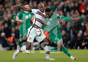 2021-11-11 - Danilo Pereira of Portugal and Chiedozie Ogbene of Ireland during the FIFA World Cup 2022, Qualifiers Group A football match between Republic of Ireland and Portugal on November 11, 2021 at Aviva Stadium in Dublin, Republic of Ireland - REPUBLIC OF IRELAND VS PORTUGAL - FIFA WORLD CUP - SOCCER