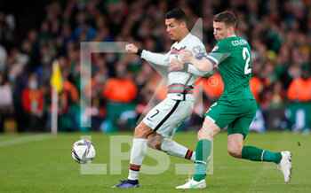 2021-11-11 - Cristiano Ronaldo of Portugal and Seamus Coleman of Ireland during the FIFA World Cup 2022, Qualifiers Group A football match between Republic of Ireland and Portugal on November 11, 2021 at Aviva Stadium in Dublin, Republic of Ireland - REPUBLIC OF IRELAND VS PORTUGAL - FIFA WORLD CUP - SOCCER