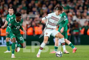 2021-11-11 - Joao Felix of Portugal and Chiedozie Ogbene of Ireland during the FIFA World Cup 2022, Qualifiers Group A football match between Republic of Ireland and Portugal on November 11, 2021 at Aviva Stadium in Dublin, Republic of Ireland - REPUBLIC OF IRELAND VS PORTUGAL - FIFA WORLD CUP - SOCCER